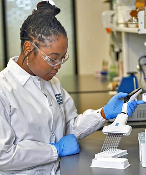 researcher filling pipets